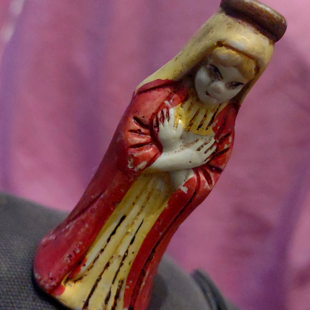 Mean looking girl glass figurine